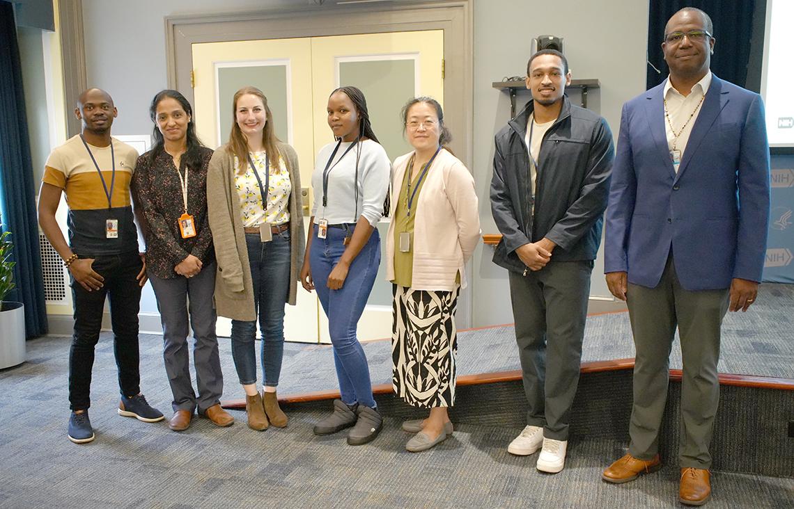 Group of fellows poses with Hanchard.